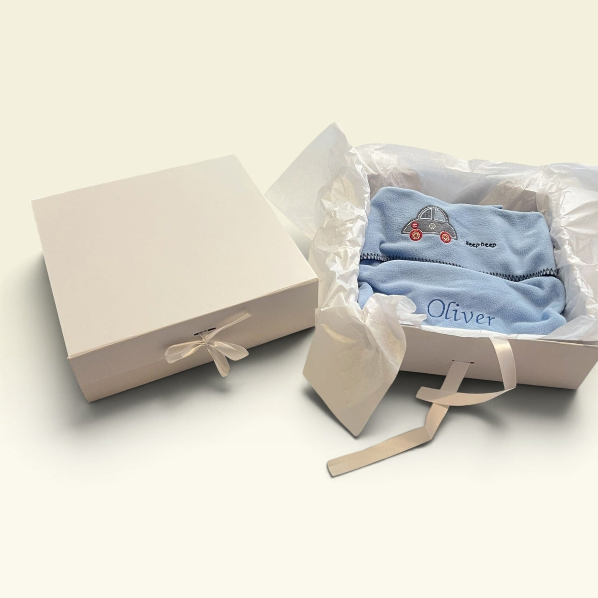 White magnetic keepsake gift box open with tissue paper and satin ribbon, newborn baby gift, can be personalised